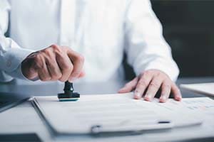 a business person approving a contract