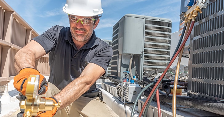 gentleman installing hvac air conditioner