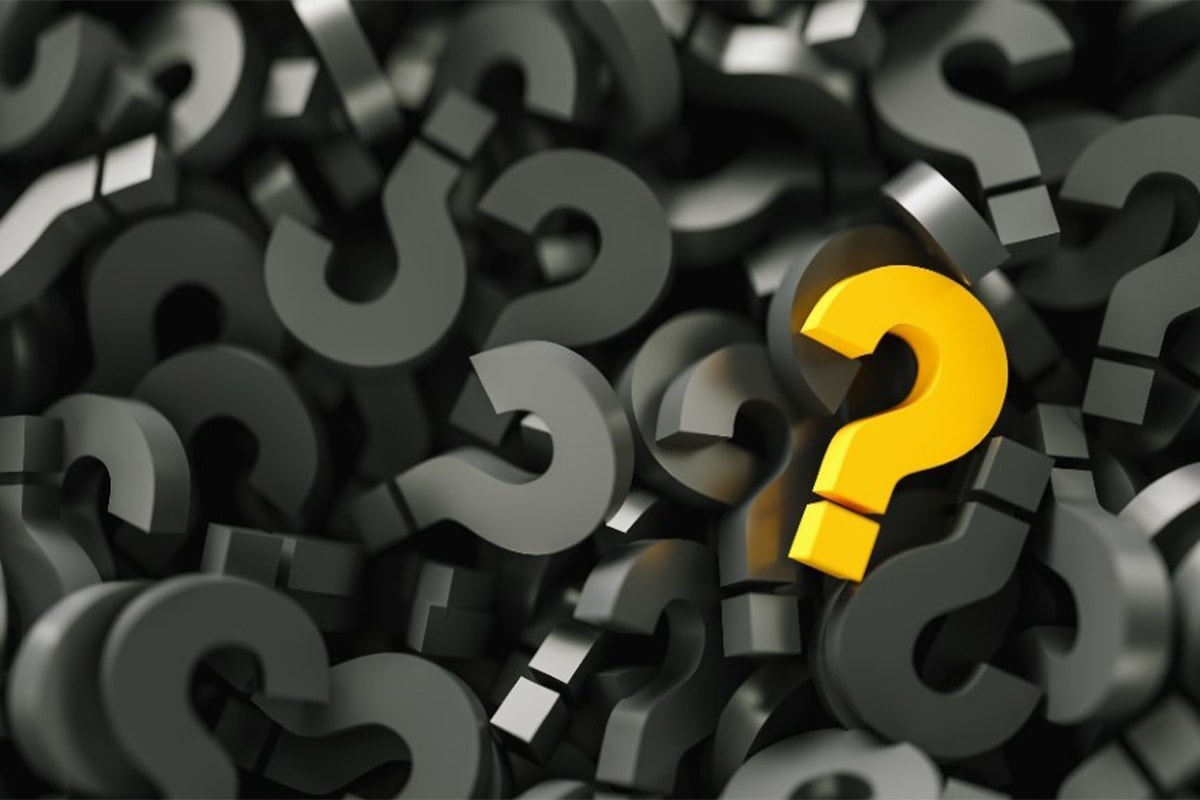 yellow question mark on top of pile of many grey question marks