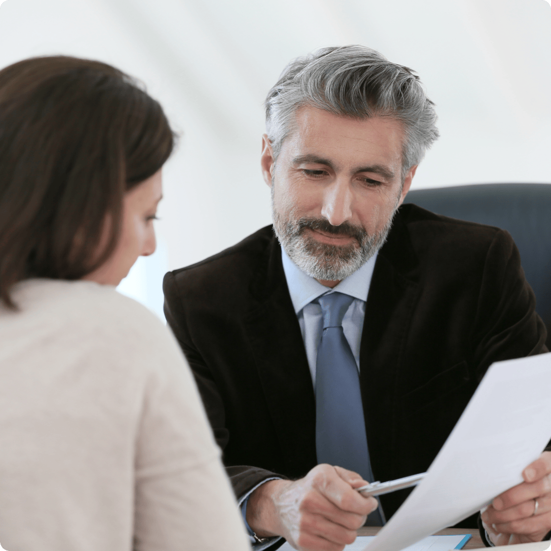 gentleman and woman looking over document