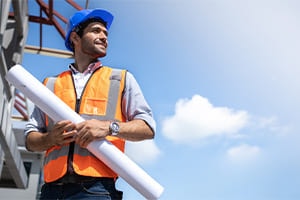 construction worker holding blueprint