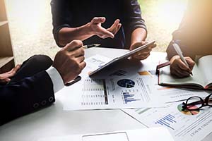 people creating a marketing plan to help sell a small business quickly