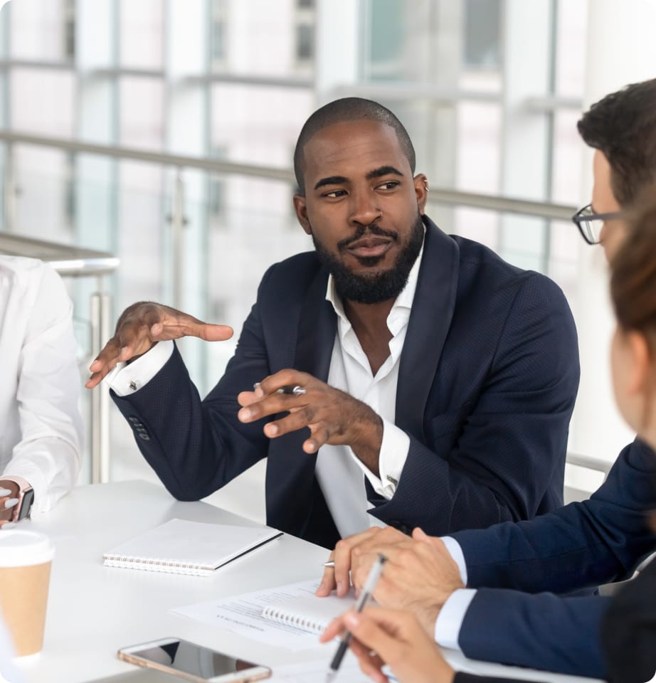 business broker talking to other brokers in meeting