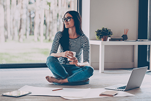 woman working on the floor at home