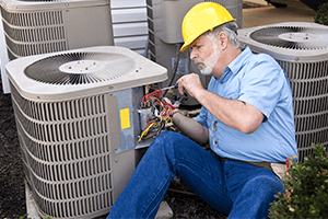 hvac business owner working on unit