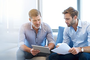 business broker and seller discussing financial matters
