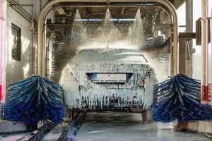 car gets cleaned through an automatic car wash