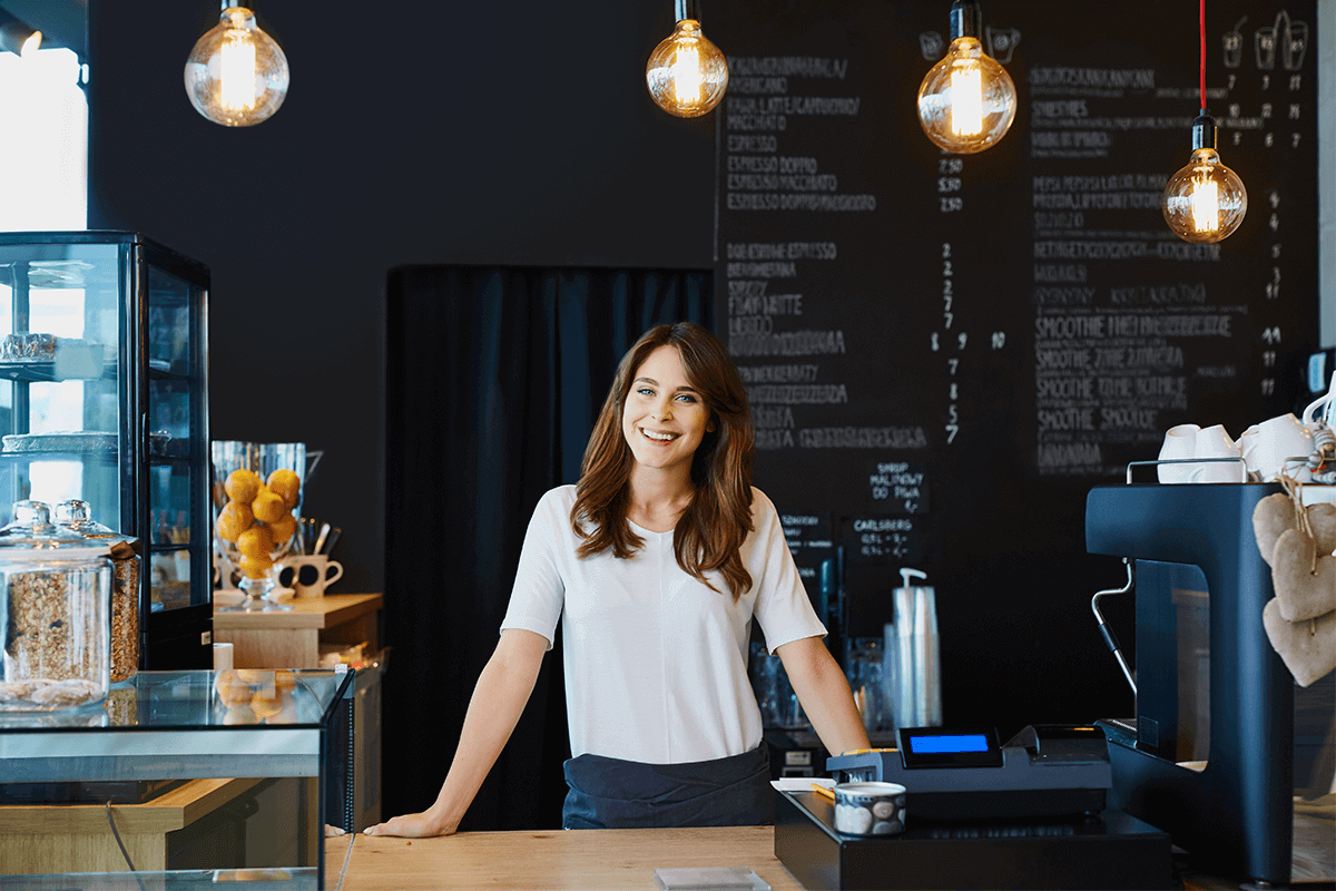 woman smiling for portrait in her business