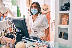 cashier wearing mask at retail store