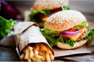 closeup of fast food burgers and fries