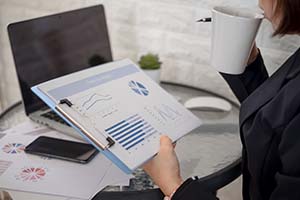 woman looking over cash flow statements