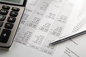a calculator and business financial statements